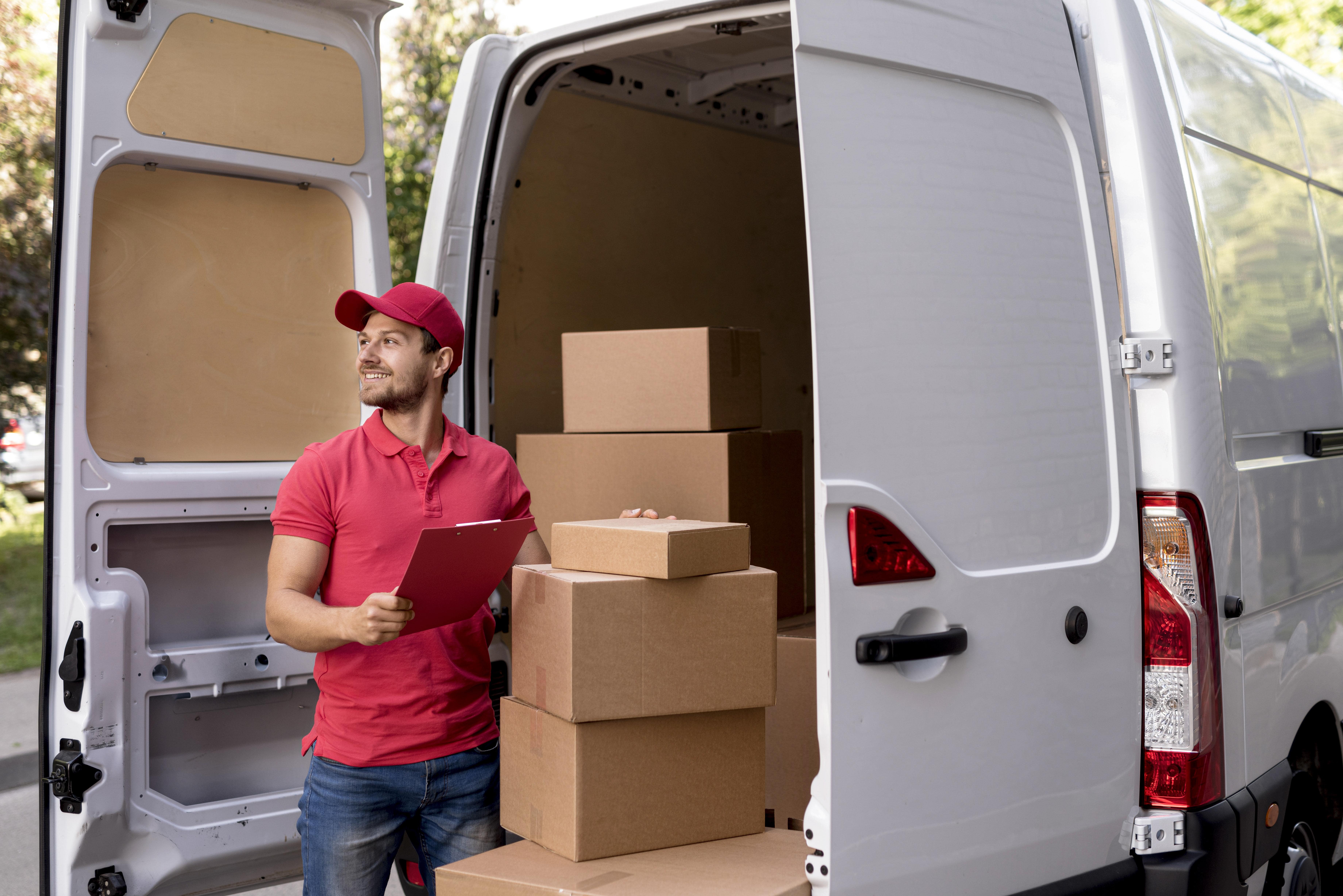 Delivery man holding box for last mile delivery